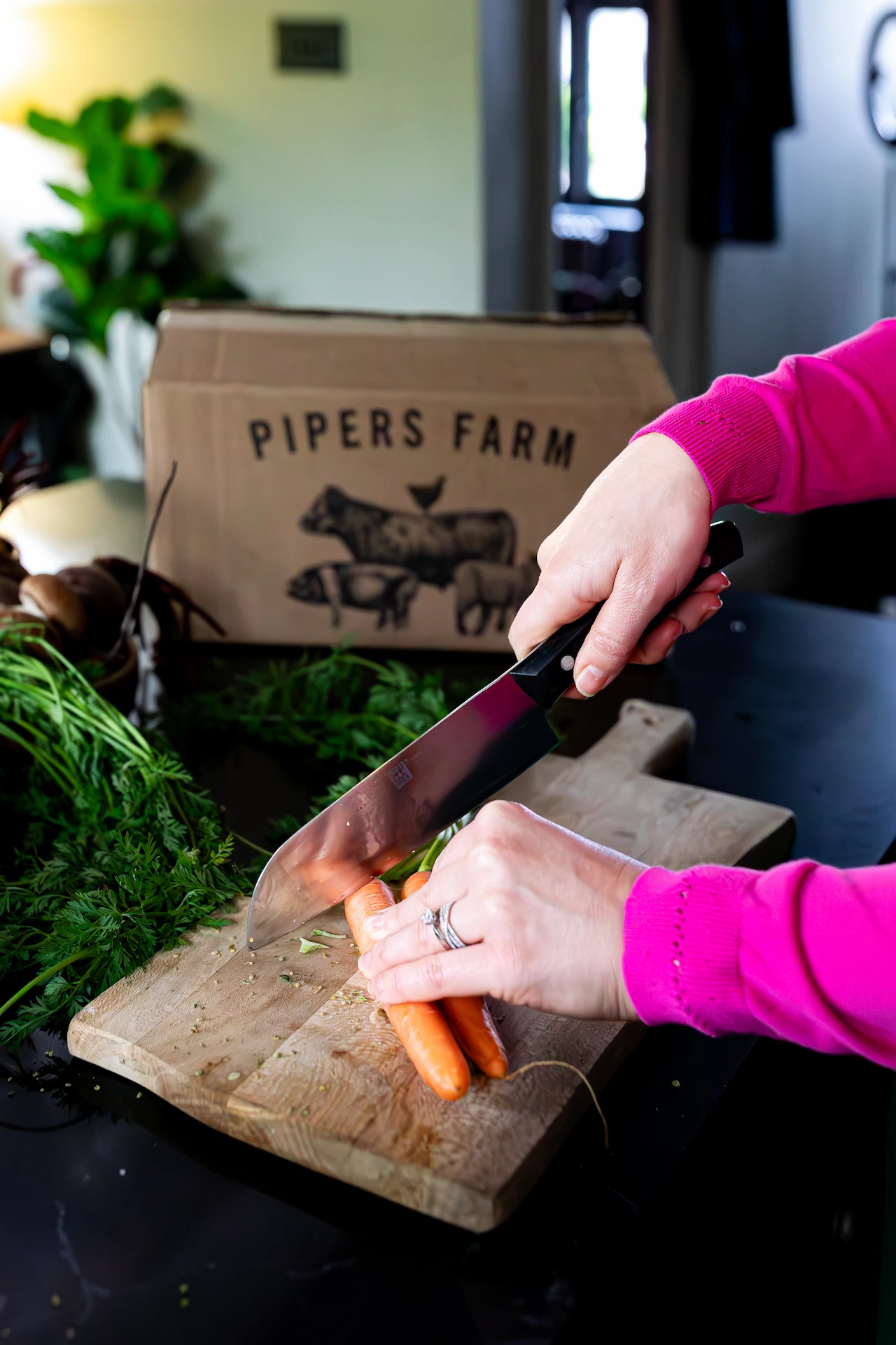 close up of natalie cutting carrots
