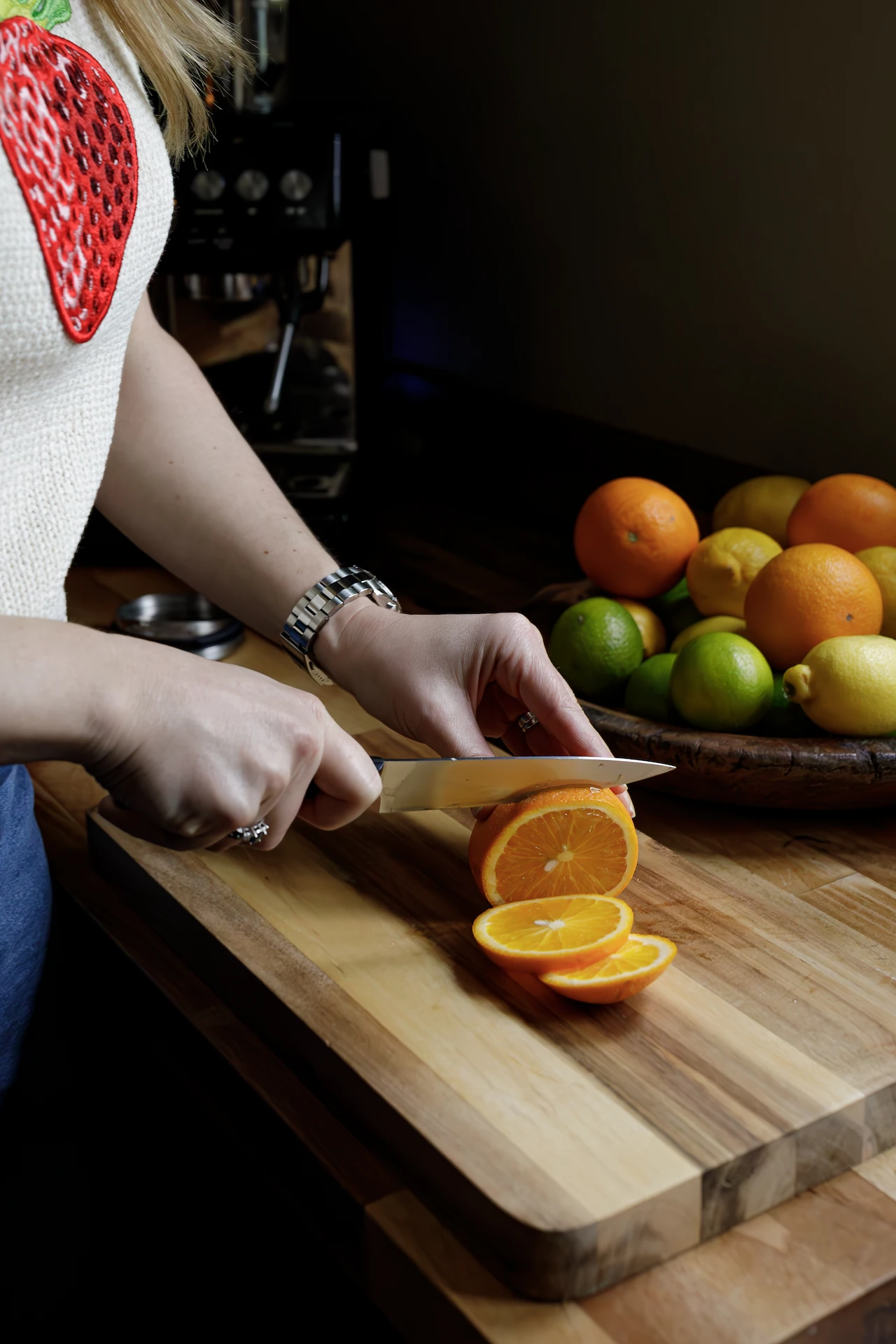 close up of natalie cutting fruit